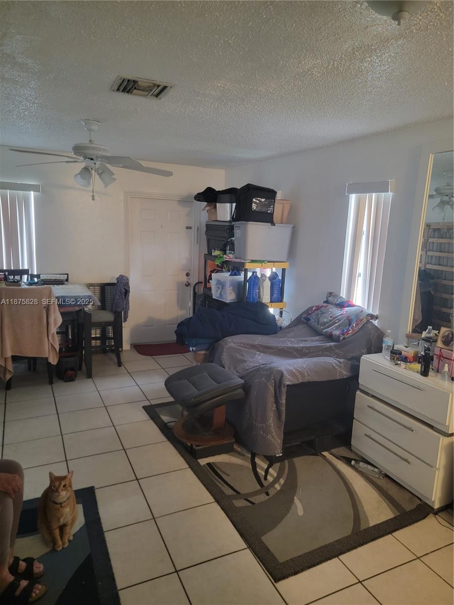 1670 Harding Street Hollywood, FL 33020 - Photo 8 of 19 a living room with hard wood flooring and furniture