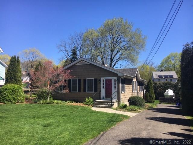 356 Round Hill Road Fairfield, CT 06824 - Photo 1 of 1 a front view of a house with garden