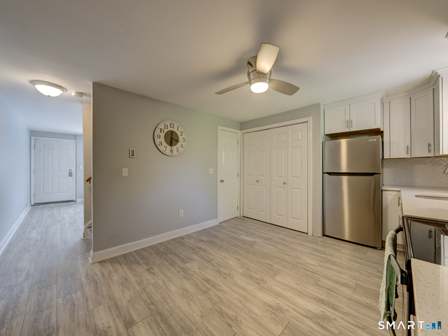 2 Branch Road, Unit 2C Thomaston, CT 06787 - Photo 7 of 26 a view of an empty room with wooden floor and a ceiling fan