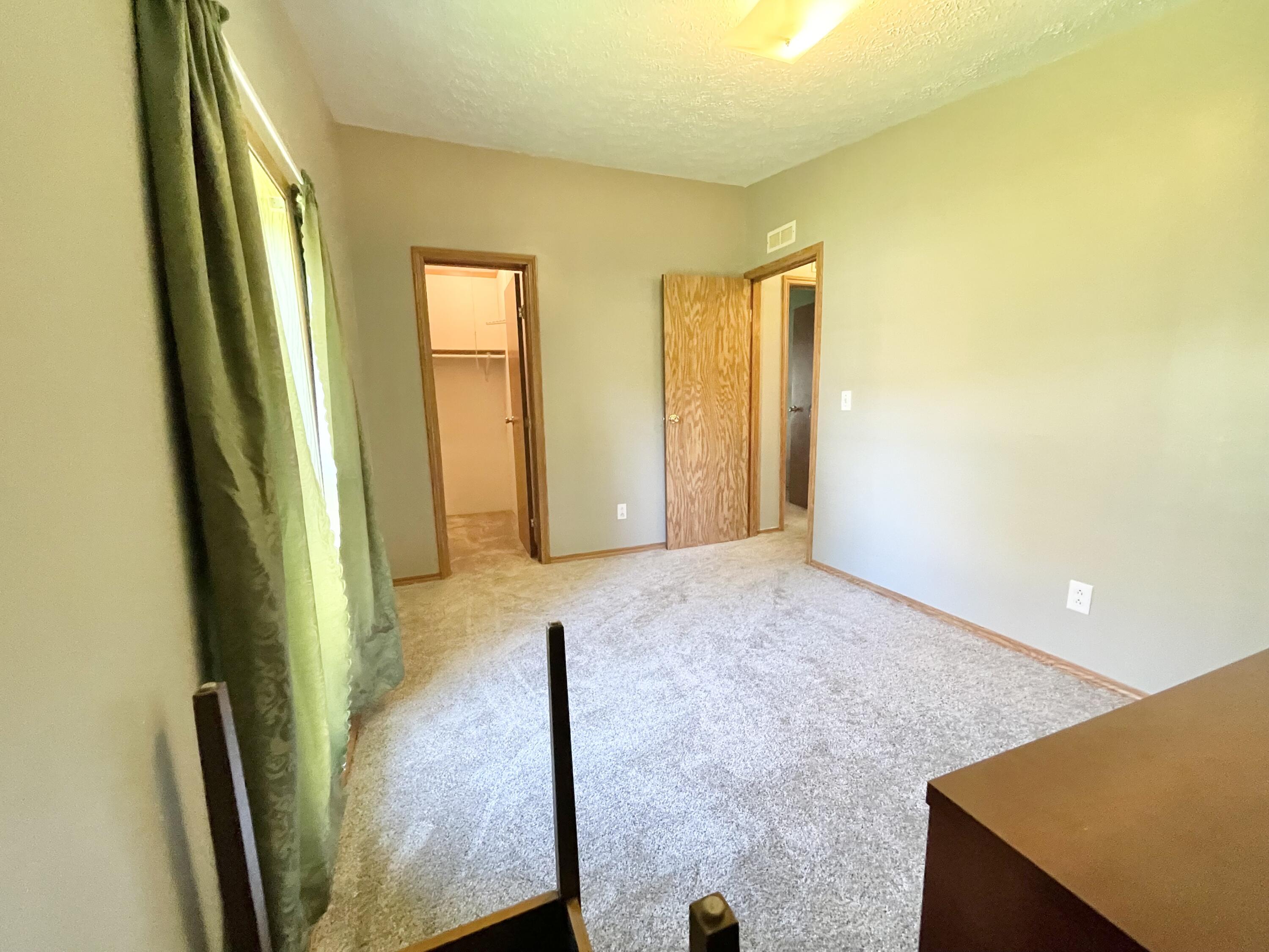 605 East Washington Street Morocco, IN 47963 - Photo 11 of 13 a view of an empty room and glass door