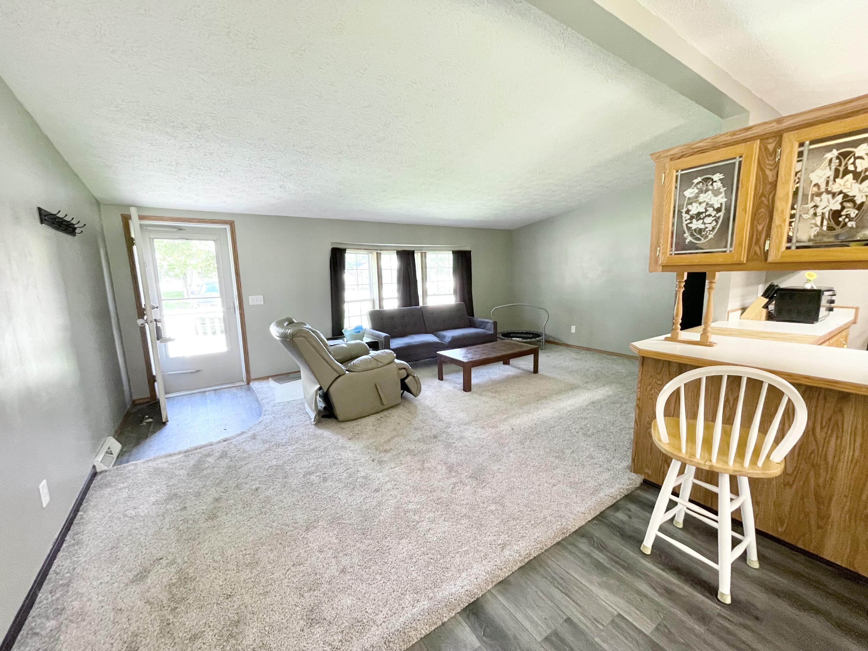 605 East Washington Street Morocco, IN 47963 - Photo 3 of 13 a living room with furniture and a flat screen tv