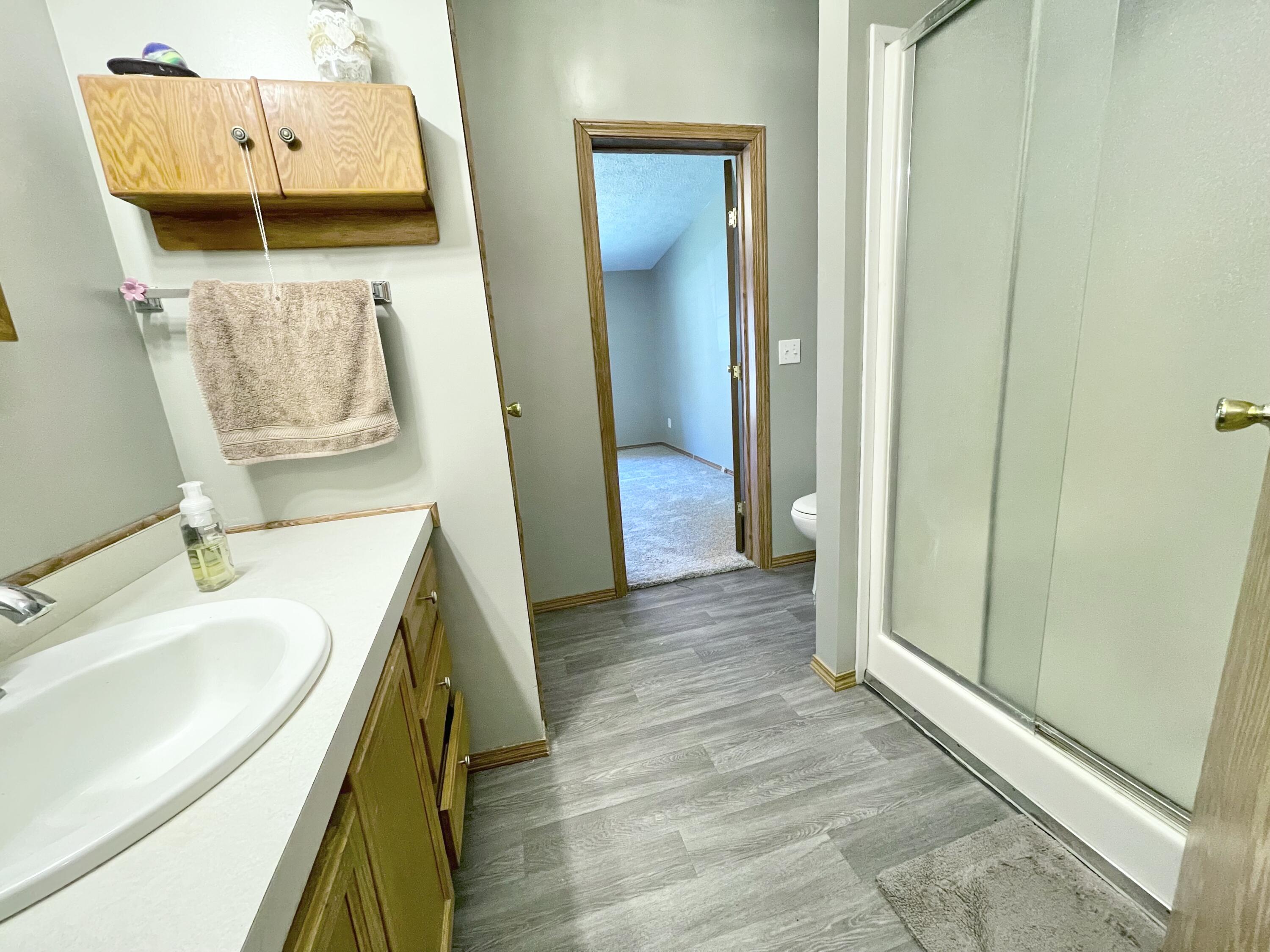 605 East Washington Street Morocco, IN 47963 - Photo 9 of 13 a bathroom with a sink and mirror