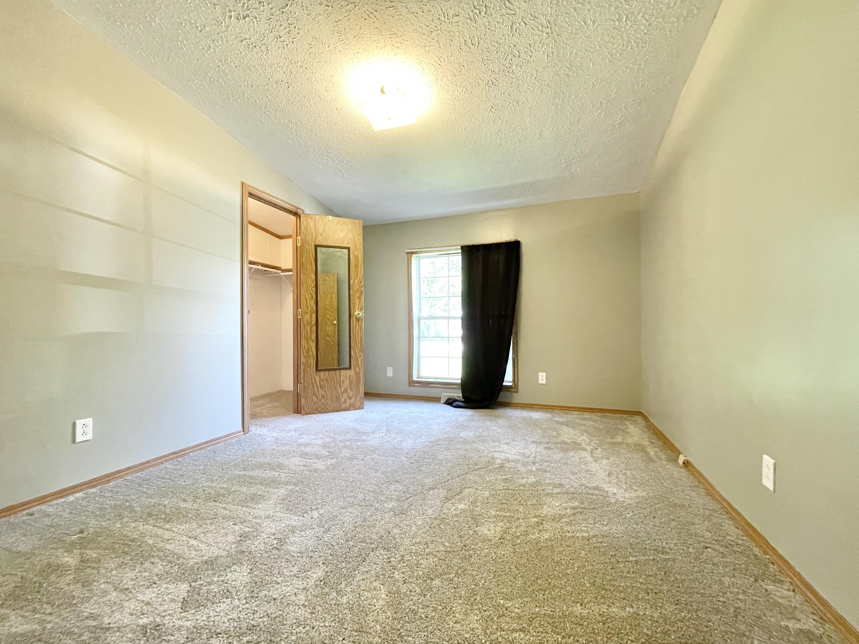 605 East Washington Street Morocco, IN 47963 - Photo 10 of 13 an empty room with a natural light