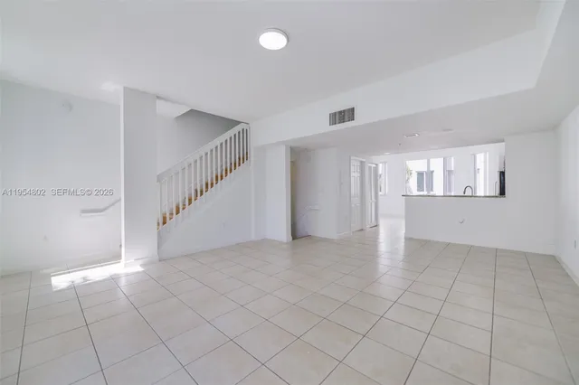 a bathroom with a double vanity sink and mirror