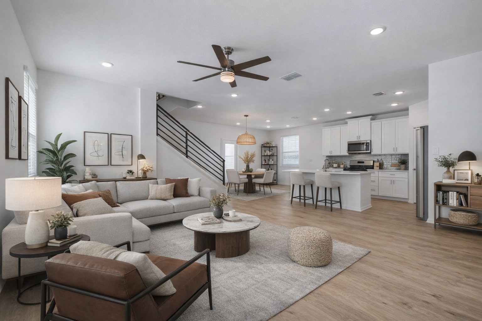 223 Rieber Road Kyle, TX 78640 - Photo 2 of 39 a living room with couches and kitchen view with wooden floor
