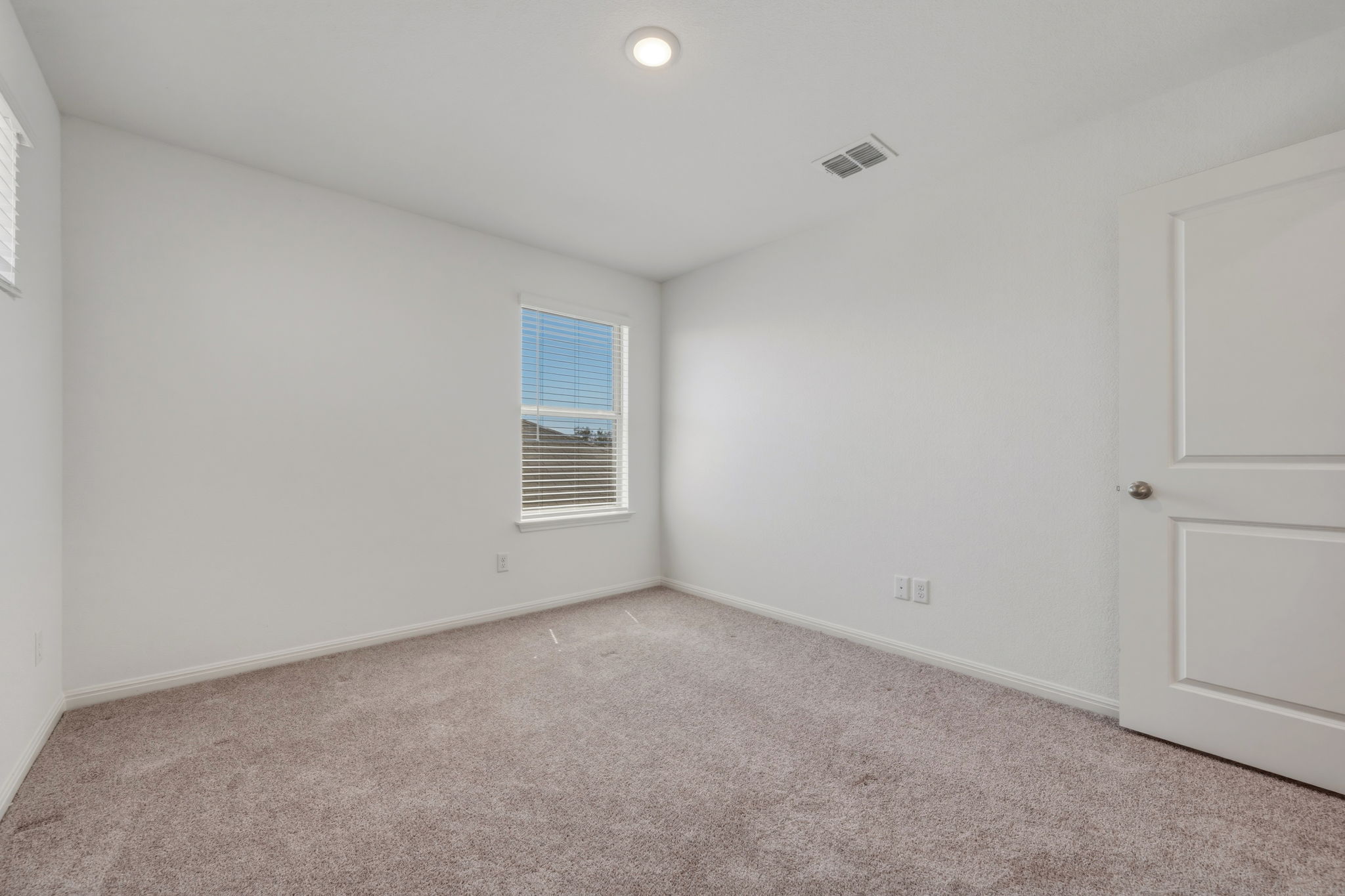 223 Rieber Road Kyle, TX 78640 - Photo 24 of 39 a view of an empty room with a window