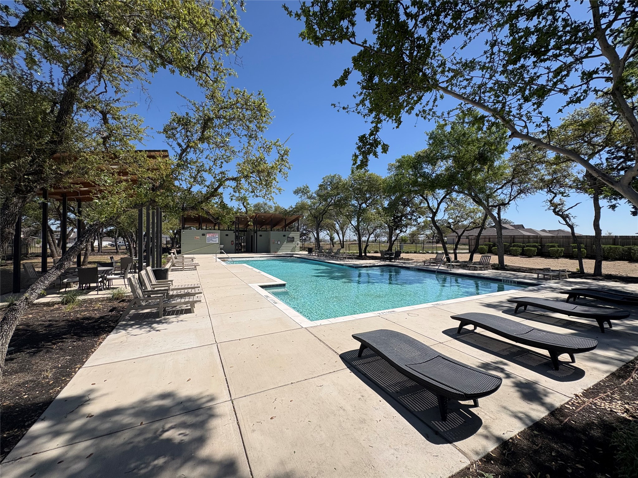 223 Rieber Road Kyle, TX 78640 - Photo 36 of 39 a view of a swimming pool with a patio