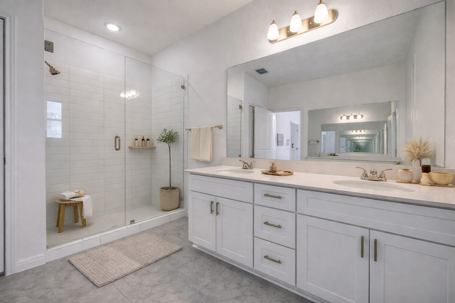 223 Rieber Road Kyle, TX 78640 - Photo 4 of 39 a spacious bathroom with double sink a toilet a shower and a mirror