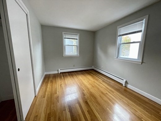 59 Desoto Road, Unit 2 Boston, MA 02132 - Photo 10 of 13 a view of empty room with wooden floor and fan