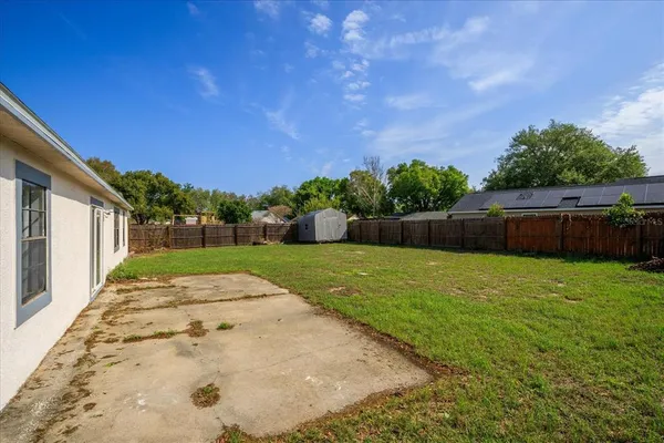 a view of backyard with green space