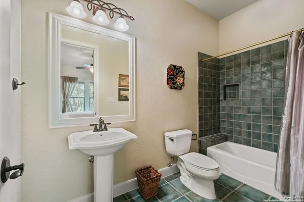 a utility room with cabinets washer and dryer