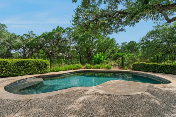a view of a backyard with a small pool