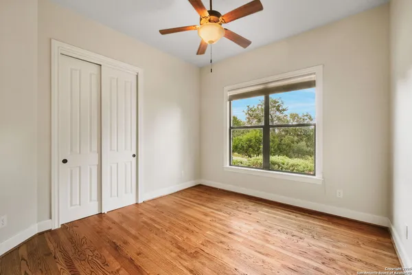 a dining room with furniture and a floor to ceiling window