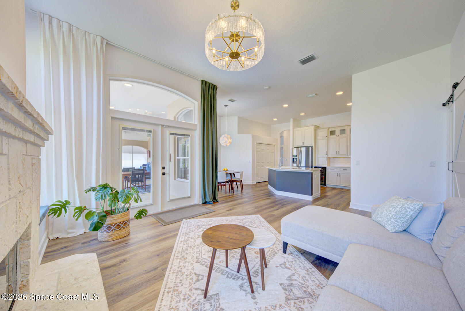 4070 Stoney Point Road Melbourne, FL 32940 - Photo 26 of 78 family room with door to lanai