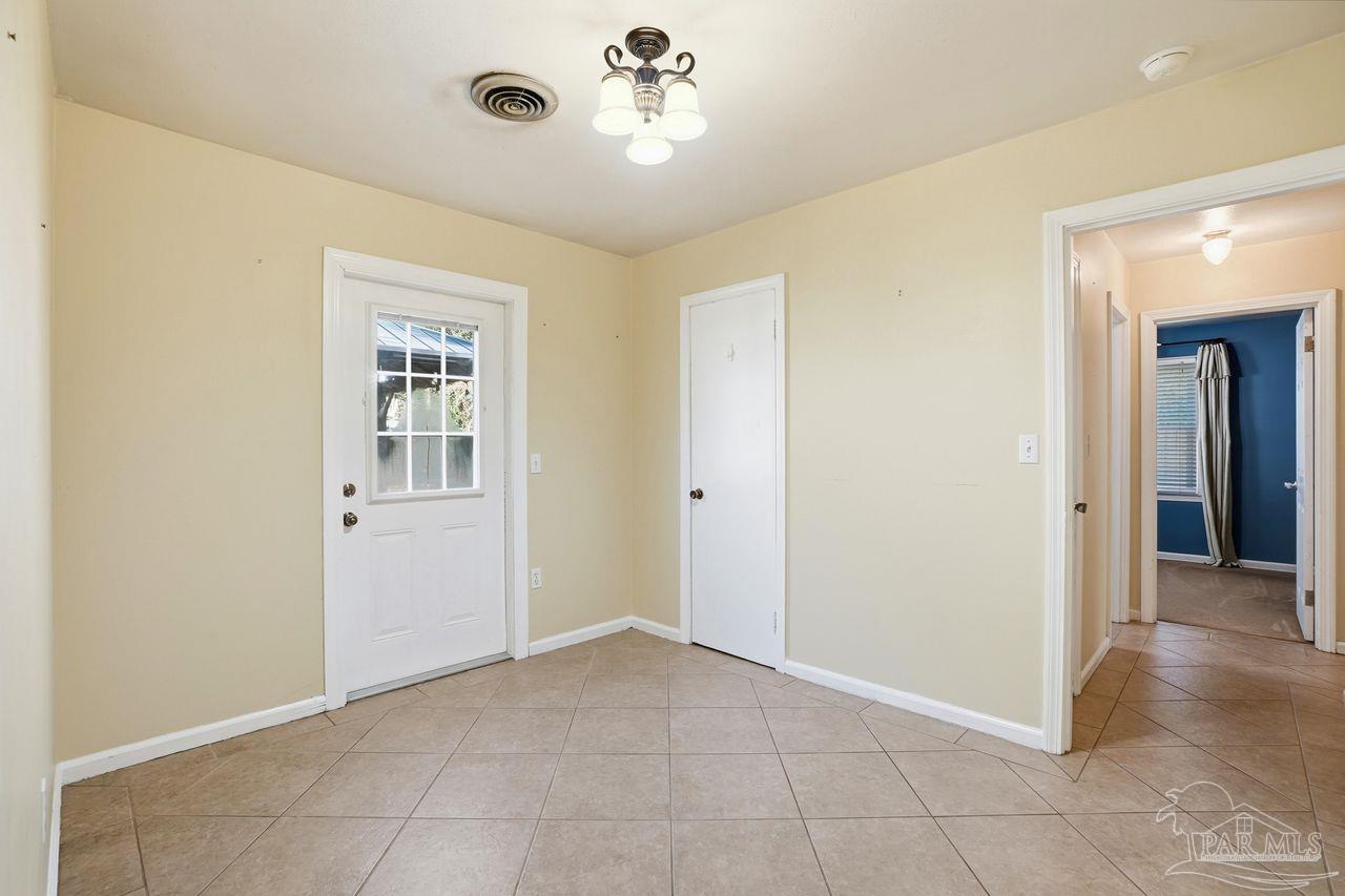 6444 Walnut Street Milton, FL 32570 - Photo 12 of 33 a view of an empty room with a window