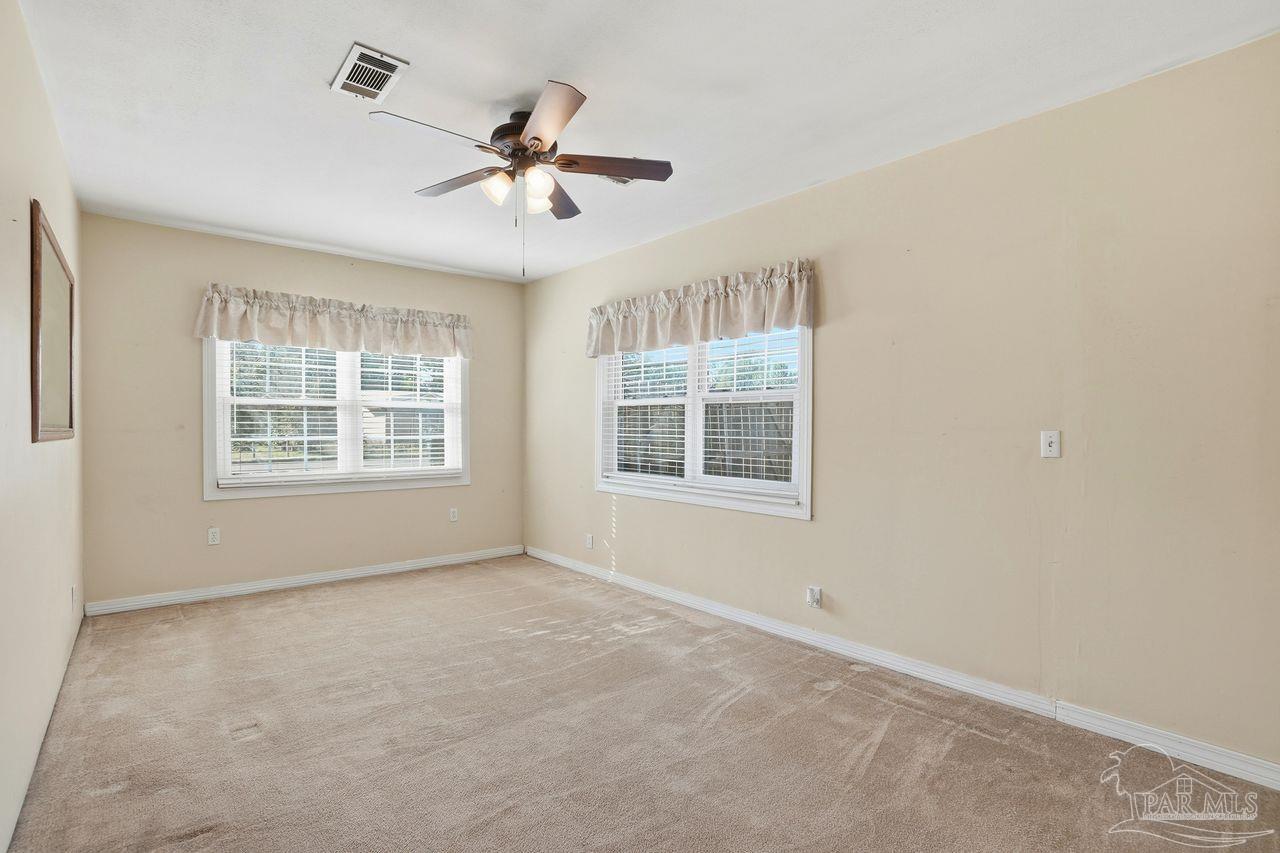 6444 Walnut Street Milton, FL 32570 - Photo 15 of 33 a view of an empty room with a window