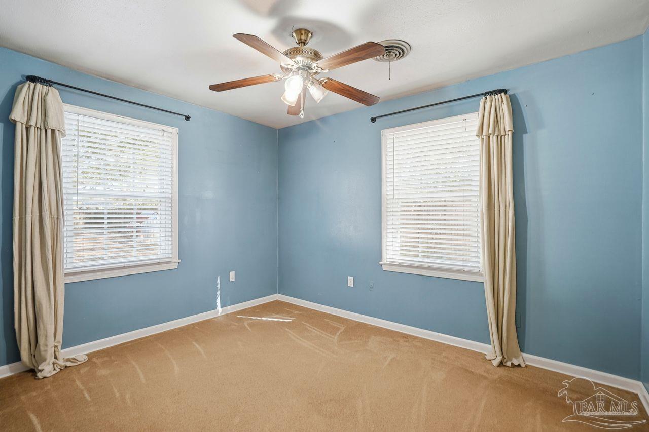 6444 Walnut Street Milton, FL 32570 - Photo 18 of 33 a view of an empty room with a window