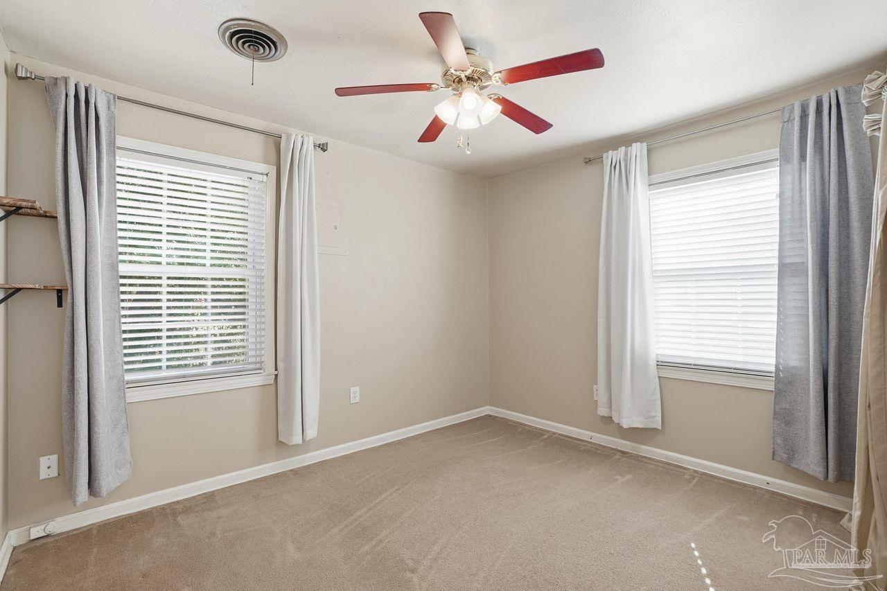 6444 Walnut Street Milton, FL 32570 - Photo 21 of 33 a view of an empty room with a window