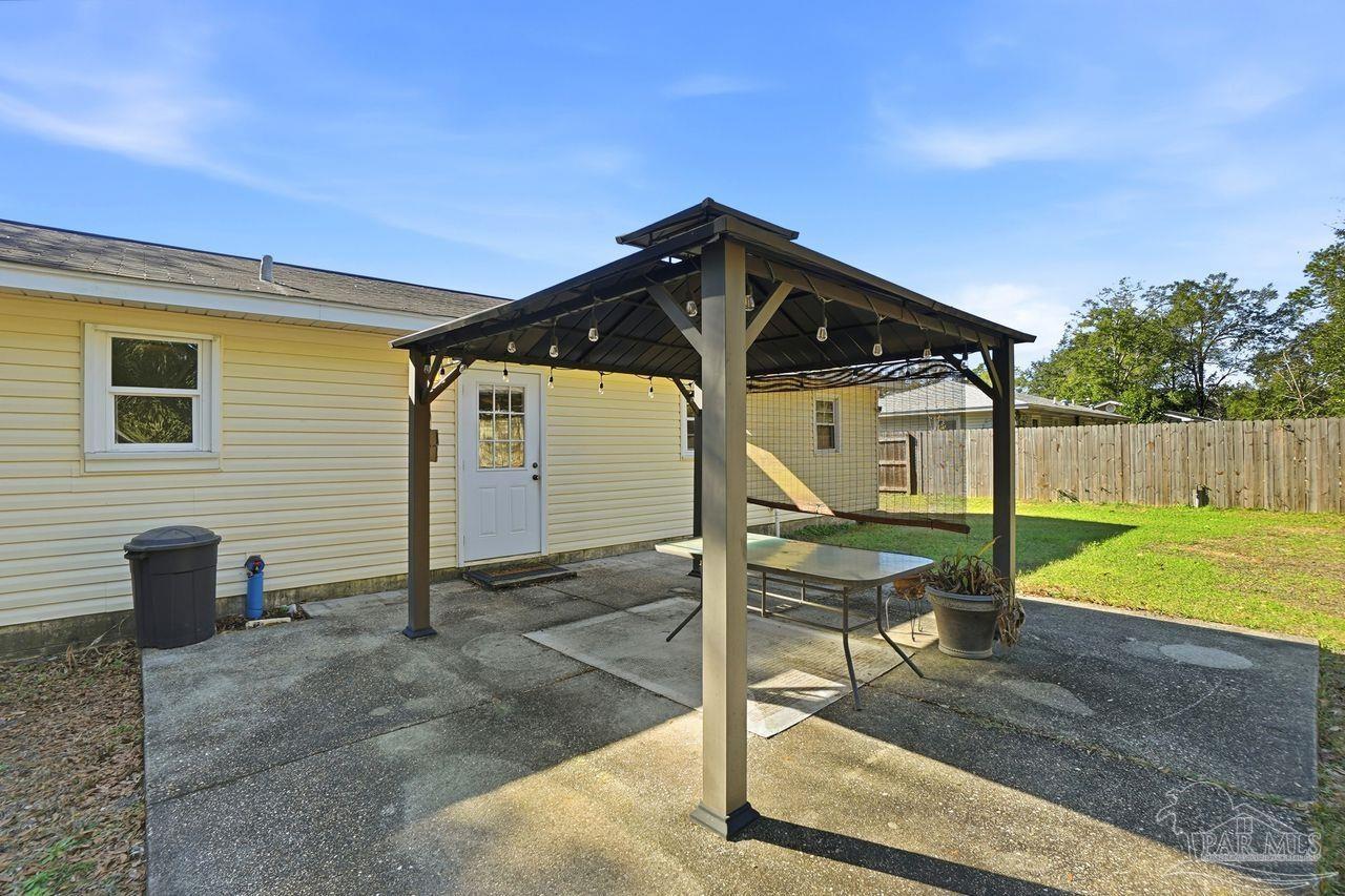 6444 Walnut Street Milton, FL 32570 - Photo 26 of 33 a front view of a house having patio