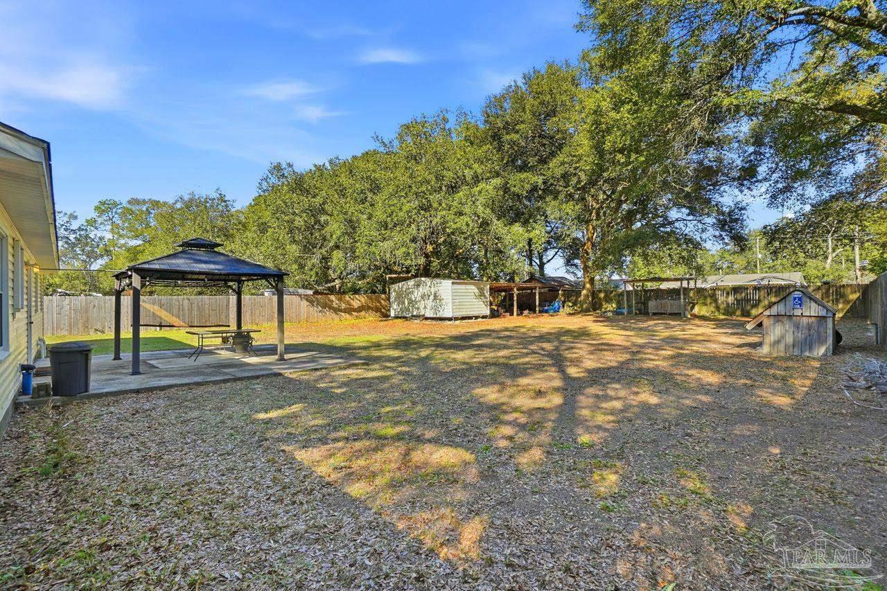 6444 Walnut Street Milton, FL 32570 - Photo 28 of 33 a view of yard with tree in the background