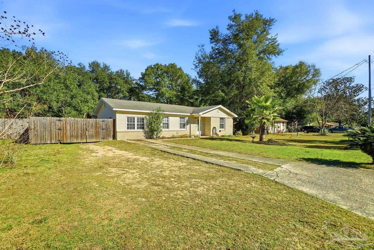 6444 Walnut Street Milton, FL 32570 - Photo 3 of 33 a house view with a outdoor space