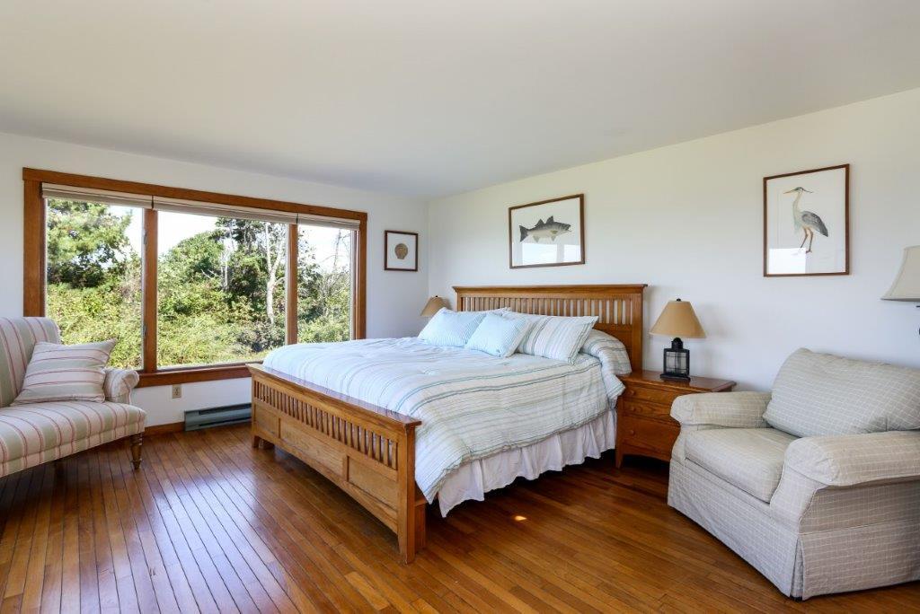 114 Quaker Road Falmouth, MA 02540 - Photo 12 of 35 a bedroom with a bed couch and a large window