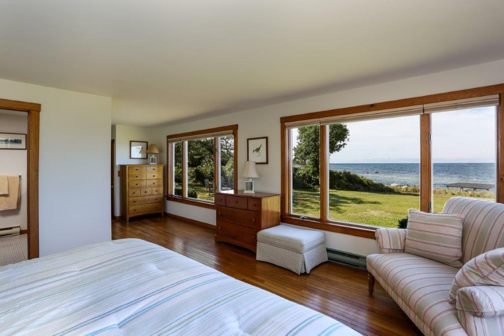 114 Quaker Road Falmouth, MA 02540 - Photo 13 of 35 a bedroom with furniture and large windows