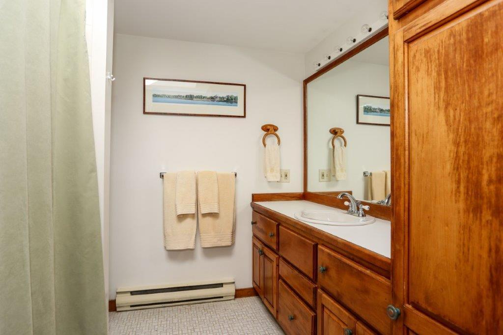 114 Quaker Road Falmouth, MA 02540 - Photo 14 of 35 a bathroom with a shower sink and mirror