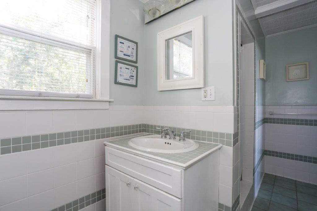 114 Quaker Road Falmouth, MA 02540 - Photo 19 of 35 a view of a bathroom with a sink and a window