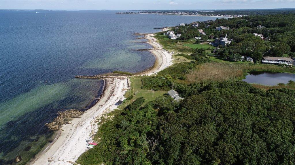114 Quaker Road Falmouth, MA 02540 - Photo 2 of 35 a view of a lake with a yard and mountain view