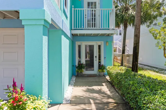 a view of a house with a small yard