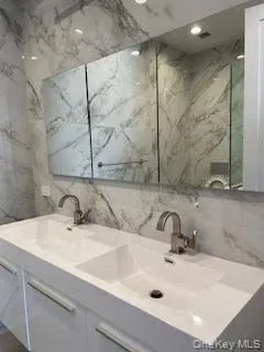 a bathroom with a sink and a mirror