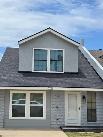 a front view of a house with a garage
