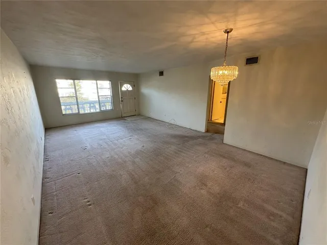 a view of empty room with windows