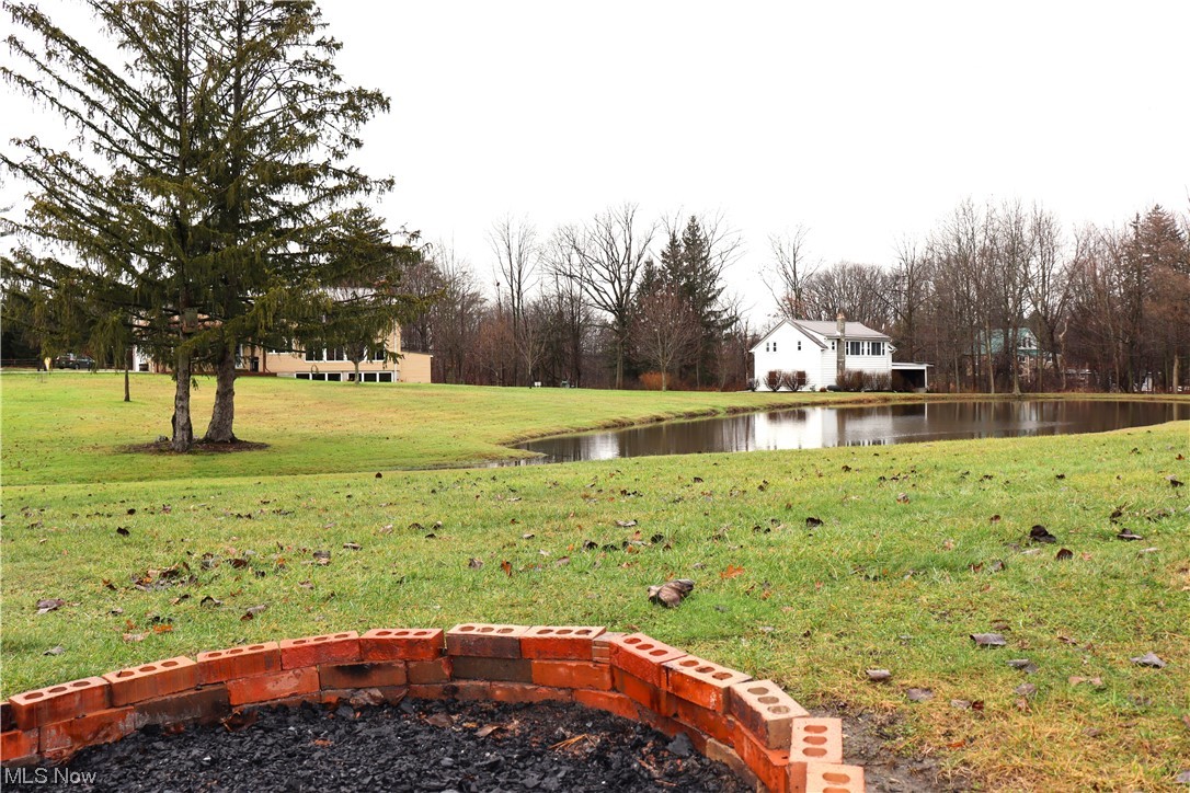 12099 County Line Road Chesterland, OH 44026 - Photo 27 of 35 Fire pit halfway to the end of the property, it overlooks the carriage house where you will find the 2nd apartment.