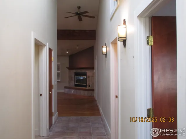 a view of a room with a table chairs and wooden floor