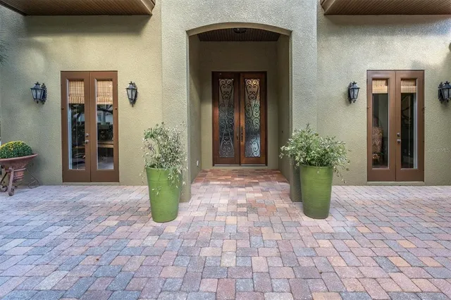 a living room with furniture large window and a fireplace