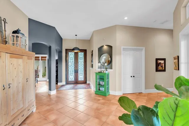 a large kitchen with a table and chairs