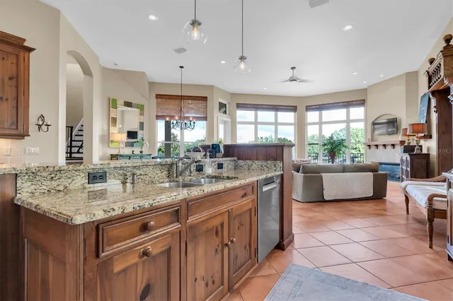 a living room with furniture a rug and decor