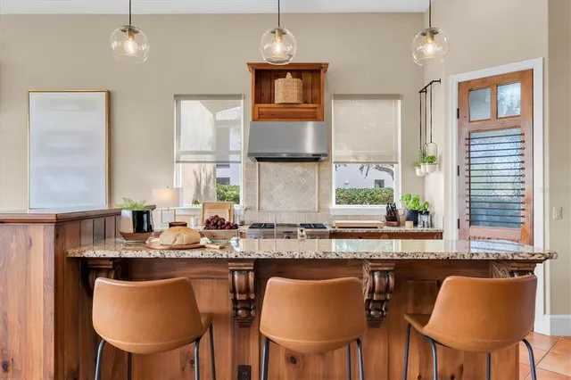 a bathroom with a sink a toilet a mirror and shower