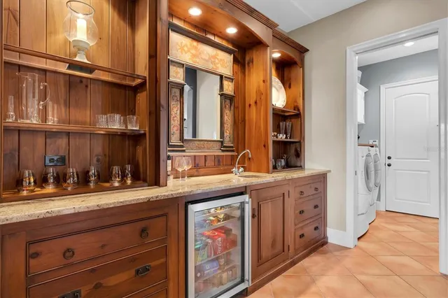 a view of a balcony with chair and wooden floor