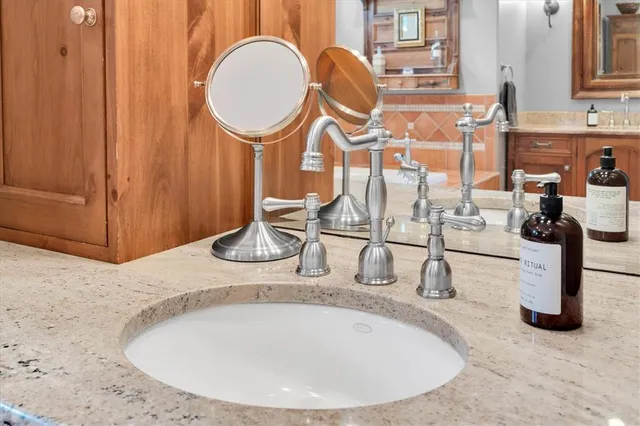 an aerial view of a house with garden space and street view