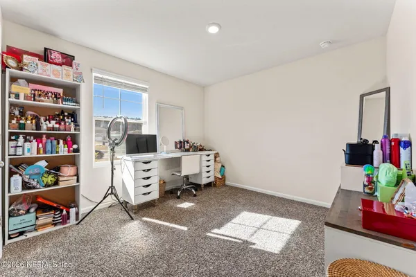 a room with furniture and white walls