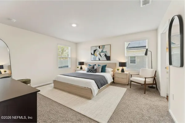 a bed room with a bed and a couch