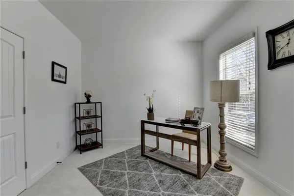 a bedroom with furniture and a window