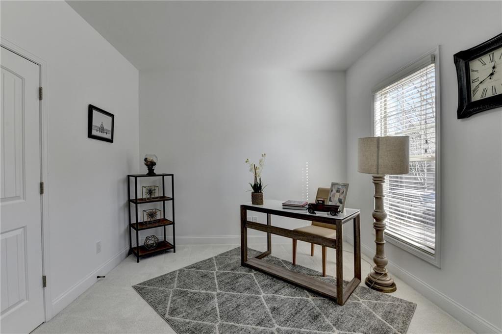3670 Baxley Ridge Drive Suwanee, GA 30024 - Photo 11 of 64 a bedroom with furniture and a window