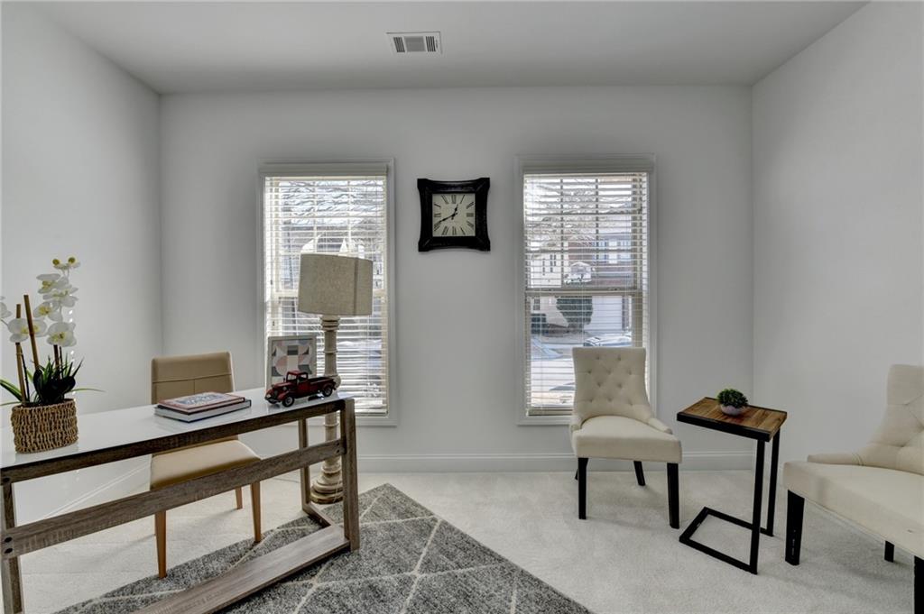 3670 Baxley Ridge Drive Suwanee, GA 30024 - Photo 12 of 64 a view of a livingroom with furniture and a window
