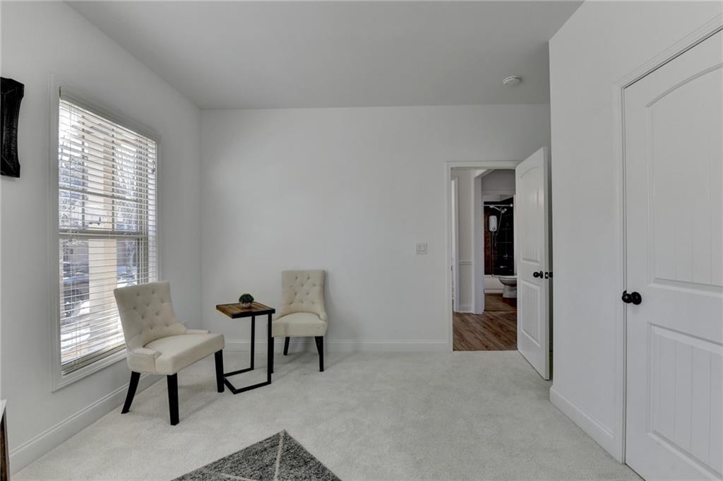 3670 Baxley Ridge Drive Suwanee, GA 30024 - Photo 13 of 64 a view of a livingroom with furniture and a window