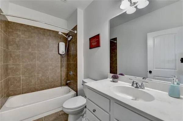 a bathroom with a sink a toilet and a bathtub