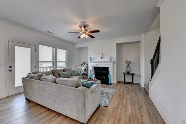 a living room with furniture and a fireplace